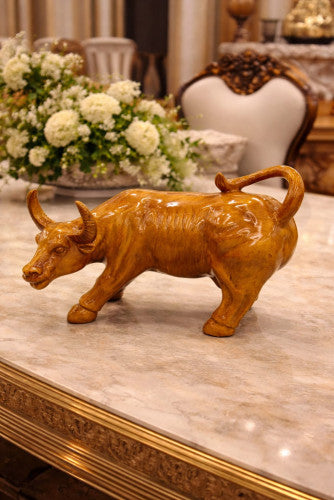 Prosperity Bull sculpture in warm golden-brown finish